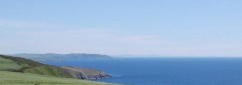 Cliff top views from the cottage towards the Mull of Galloway and the Isle of Man on a clear day Cliff top views from the cottage towards the Mull of Galloway and the Isle of Man on a clear day